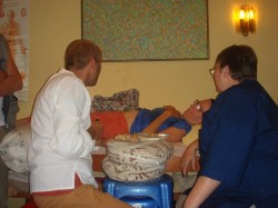 Students practising a deeply relaxing moxa treatment